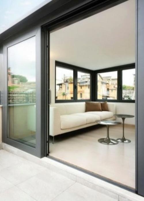 Раздвижные двери на балкон: плюсы и минусы, виды и материалы 12